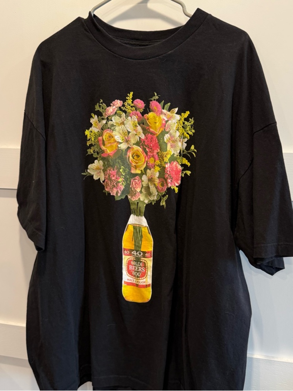 Black Short Sleeve Tee with Floral Bottle Graphic - Picture 2 of 6